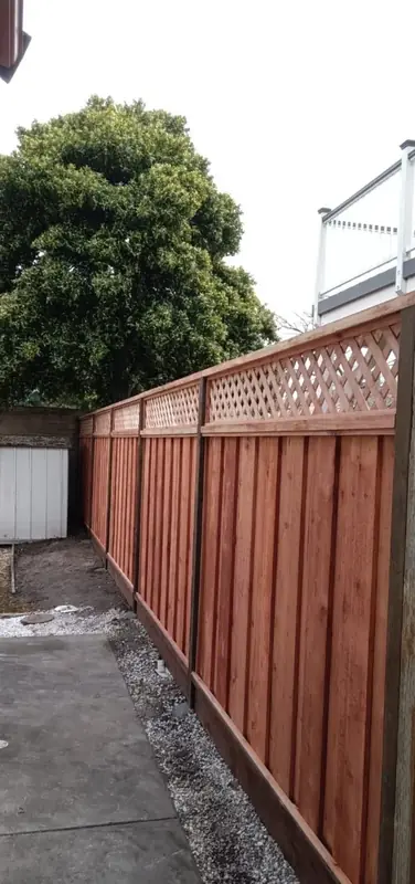 Redwood privacy fence with a lattice top