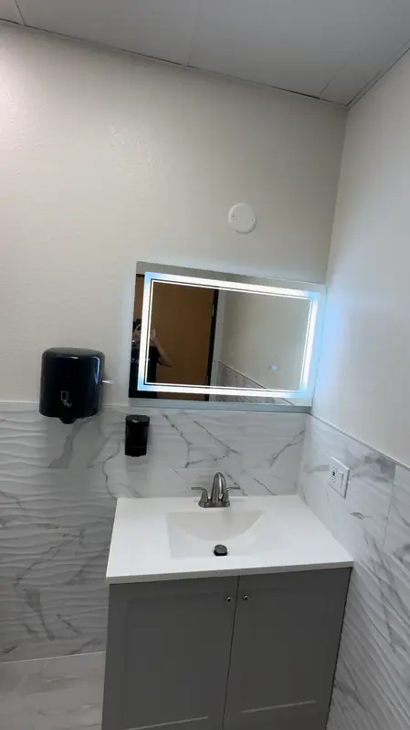 Commercial restroom vanity with LED mirror