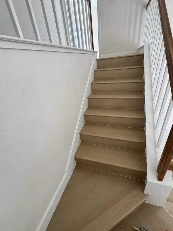 White oak staircase with painted risers and balusters